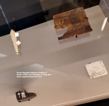 111-dynasty-1,-ivory,-wood,-Egyptian-alabaster,-Abydos,-Saqqara,-Small-model-tool-belonges-to-king-Aha-and-box-fragment,-Ancient-Egypt,-History-Pharaohs,-Grand-Egyptian-Museum
