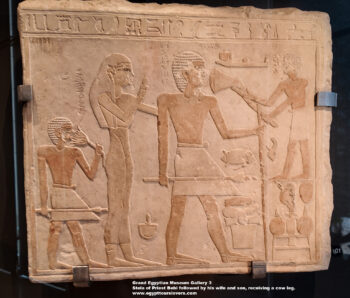 214-first-intermediate-period,-Limtone,-Dendera,-Ancient-Egypt,-History-Pharaohs,-Grand-Egyptian-Museum,-Stela-of-Priest-Bebi-followed-by-his-wife-and-son,-receiving-a-cow-leg