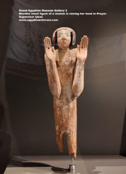 235-dynasty-5-6,-limestone,-wood,-Saqqara,-luxor,-Wooden-small-figure-of-a-woman-is-raising-her-hand-in-Prayer,-Supervisor-Iykau,-Ancient-Egypt,-History-Pharaohs,-Grand-Egyptian-Museum