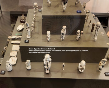 238-Naqada-III,-ivory,-Tel-al-Farkha,-Small-figures-of-men,-women-and-children,-who-worshipped-gods-at-a-shrine,-Ancient-Egypt,-History-Pharaohs,-Grand-Egyptian-Museum